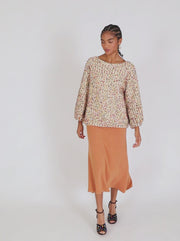 Maglione con mini pompon color crema